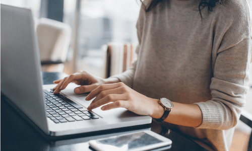 Woman typing on laptop
