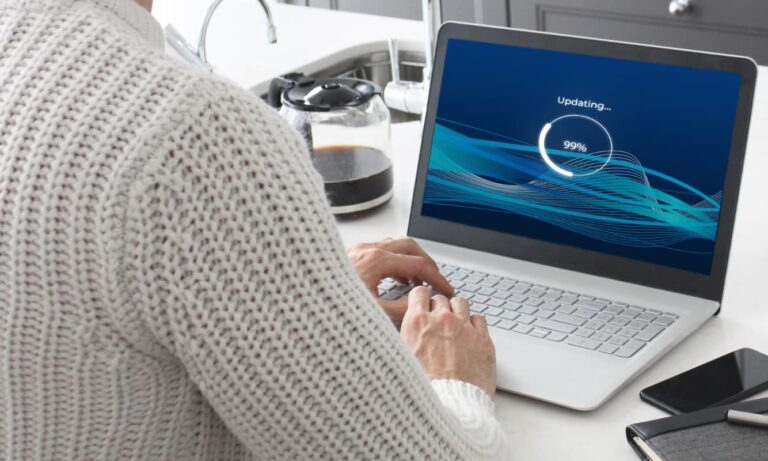 Someone updating Windows OS on a laptop