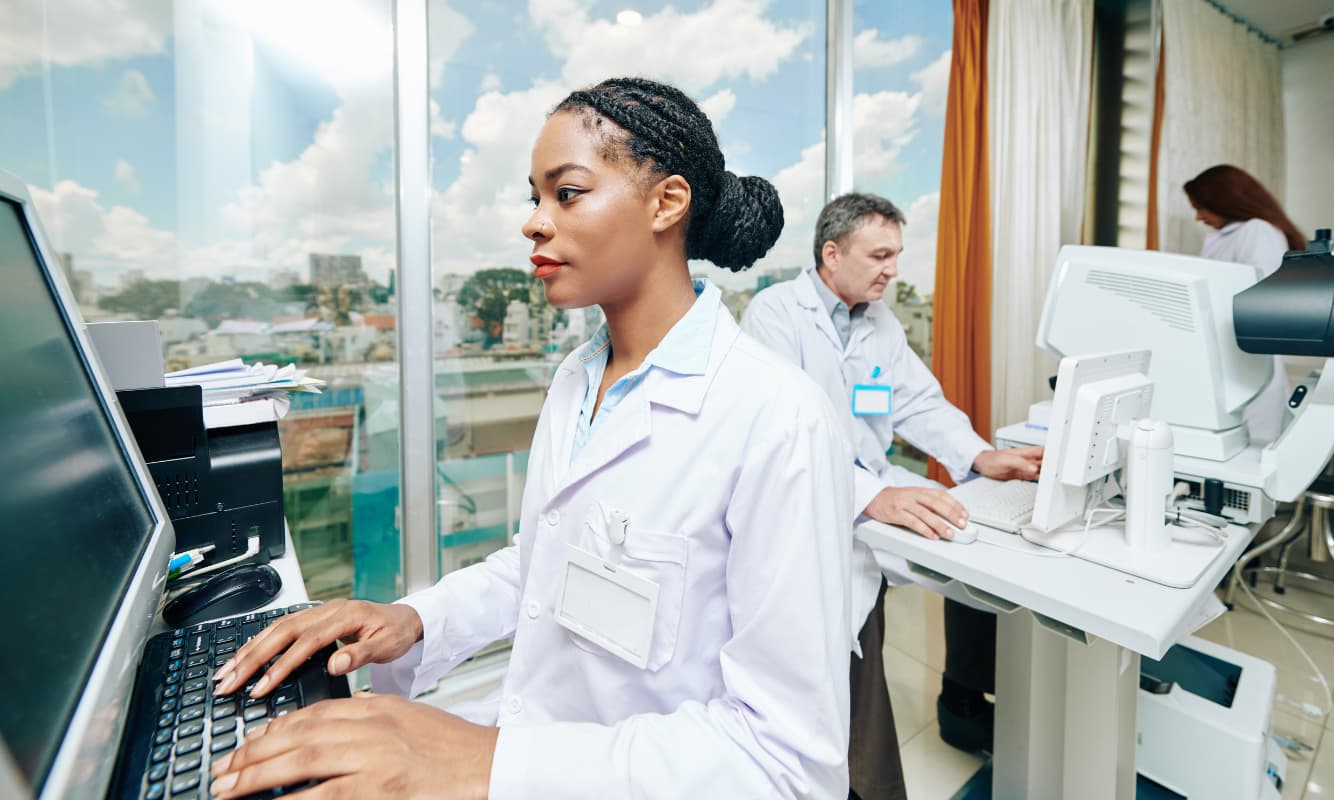 A hospital staff member using real-time analytics to provide better patient care.
