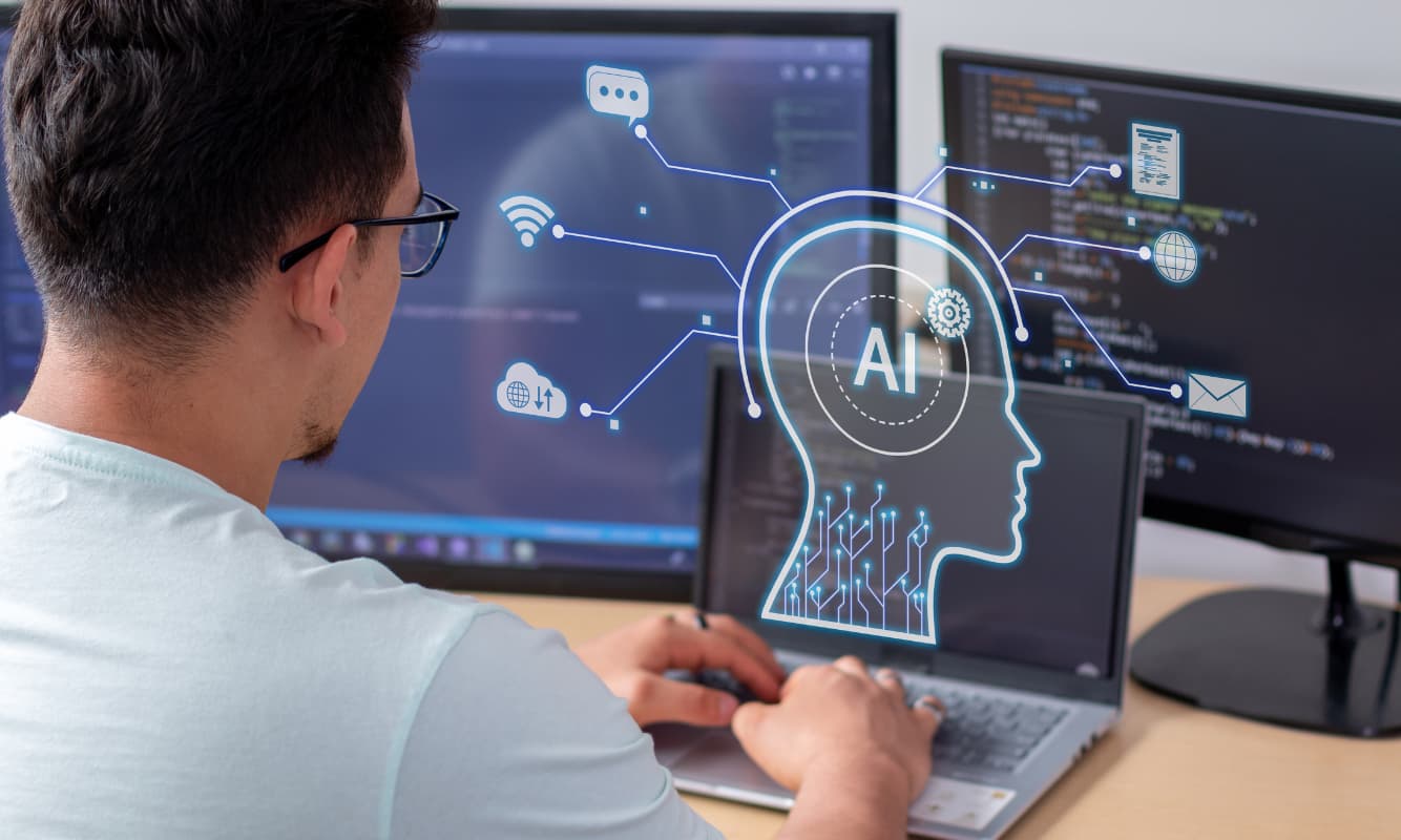 Man building an agentic AI model on a laptop