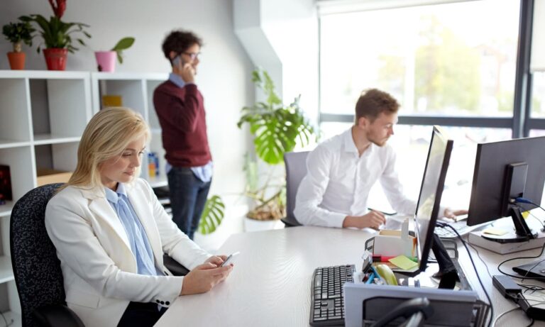 College administrators work with advanced AI tools.