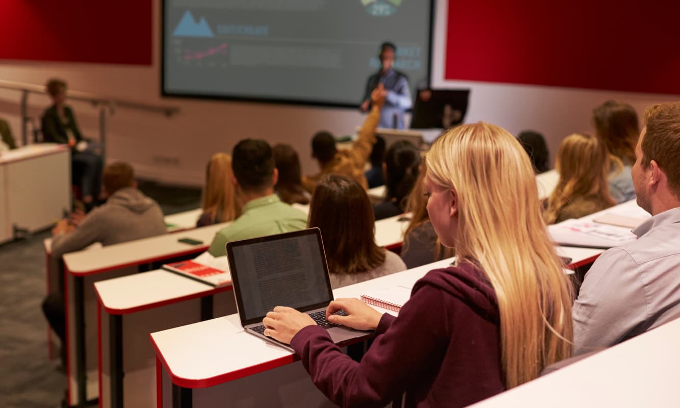 Students attending a learning session at the lecture hall.