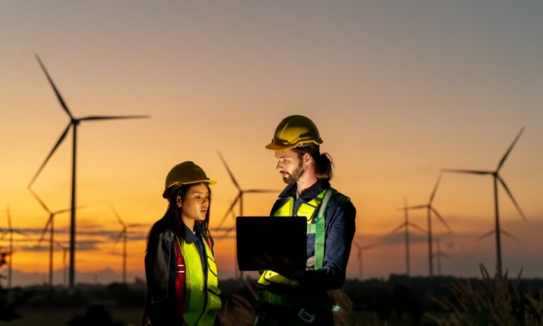 Two energy engineers discussing sustainability.