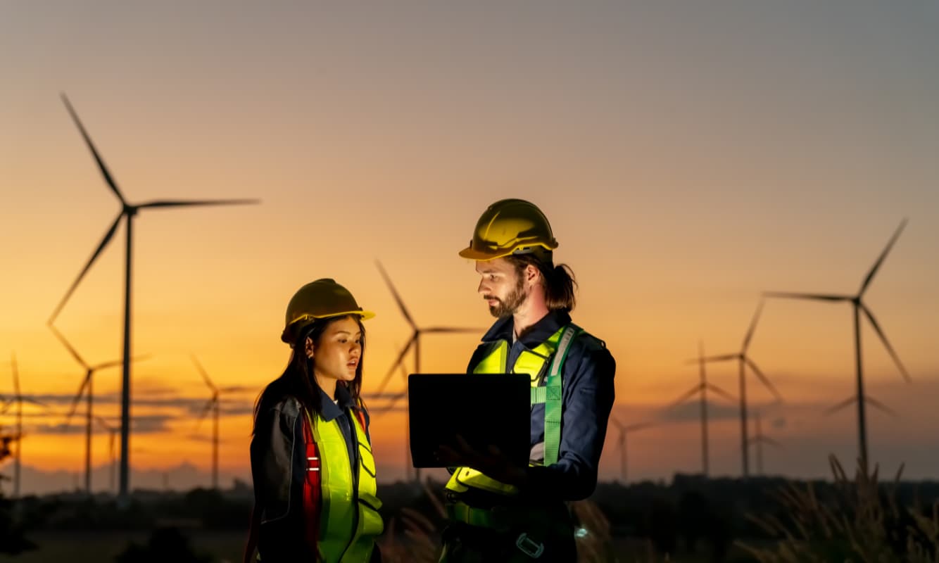 Two energy engineers discussing sustainability.