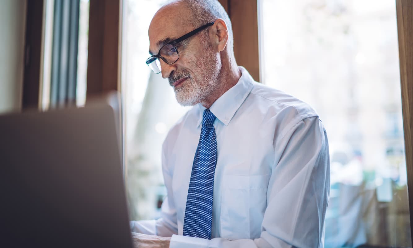 CFO reading MSP case studies to determine which managed services will help them effectively navigate rising costs.