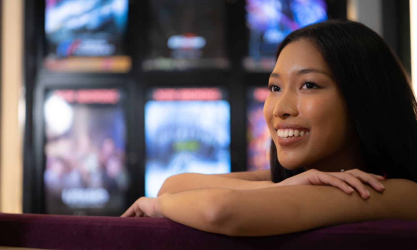 A young woman enjoys a tribal casino with the latest IT protections.
