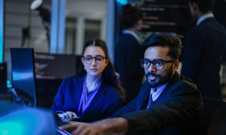 Cybersecurity professionals discussing strategies for Zero Trust in 2026