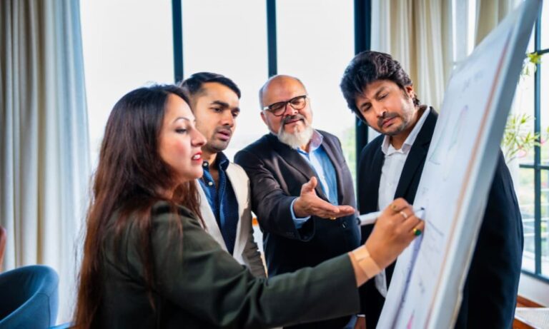 Leaders discussing their M&A IT strategy before a merger