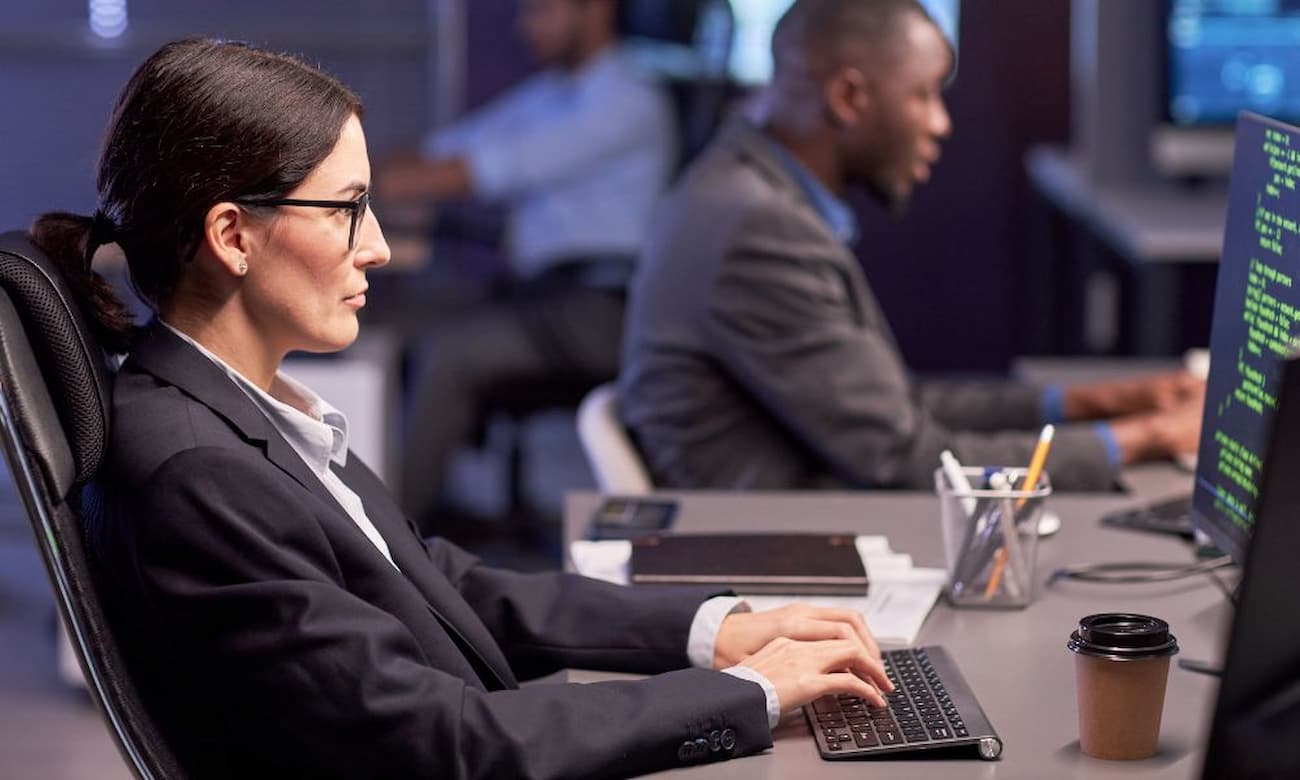 Two IT professionals developing a cloud-native application.