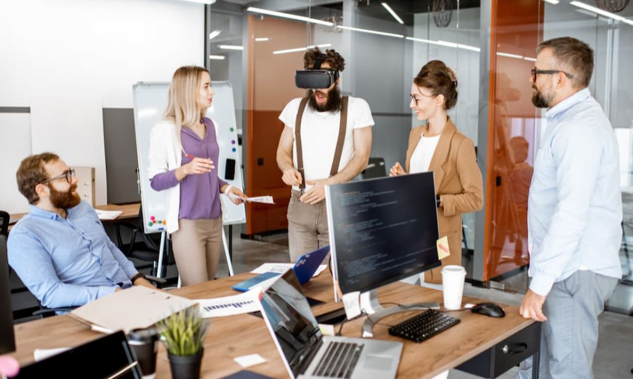 Office workers having a conference with VR goggles