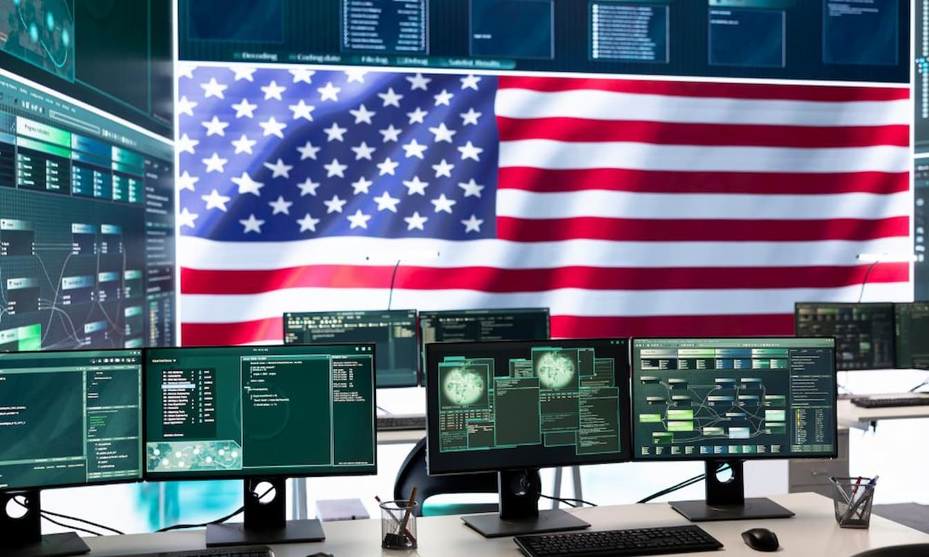 empty room showing an American flag behind monitors