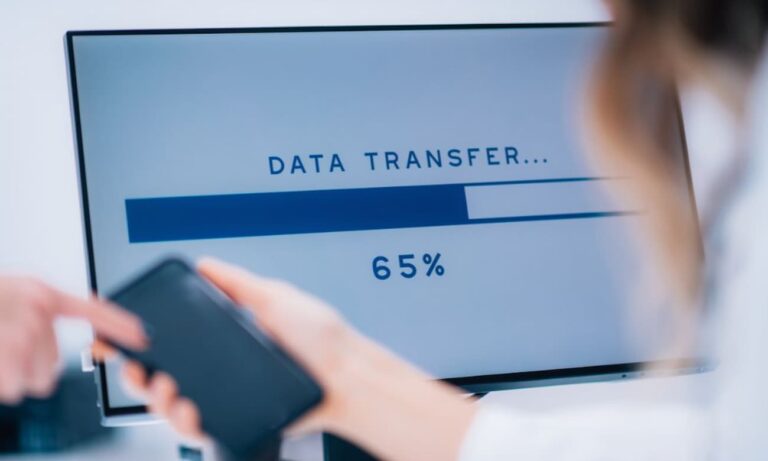 Computer screen in an office displaying a data transfer in progress