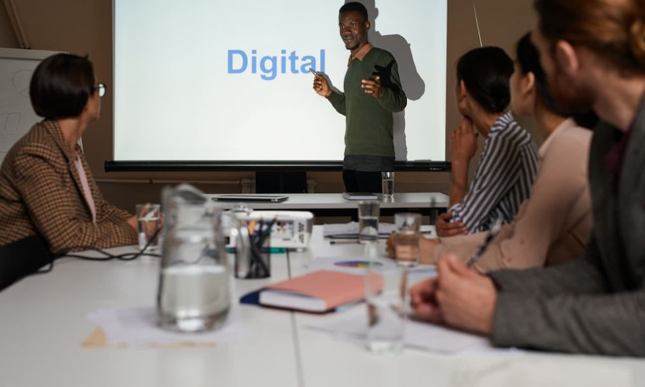 IT leader presenting digital concepts to his team