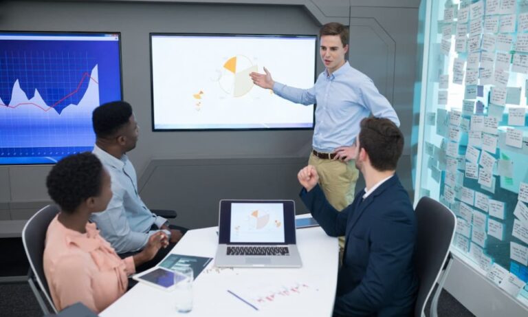 Data architect presenting data in a modern office