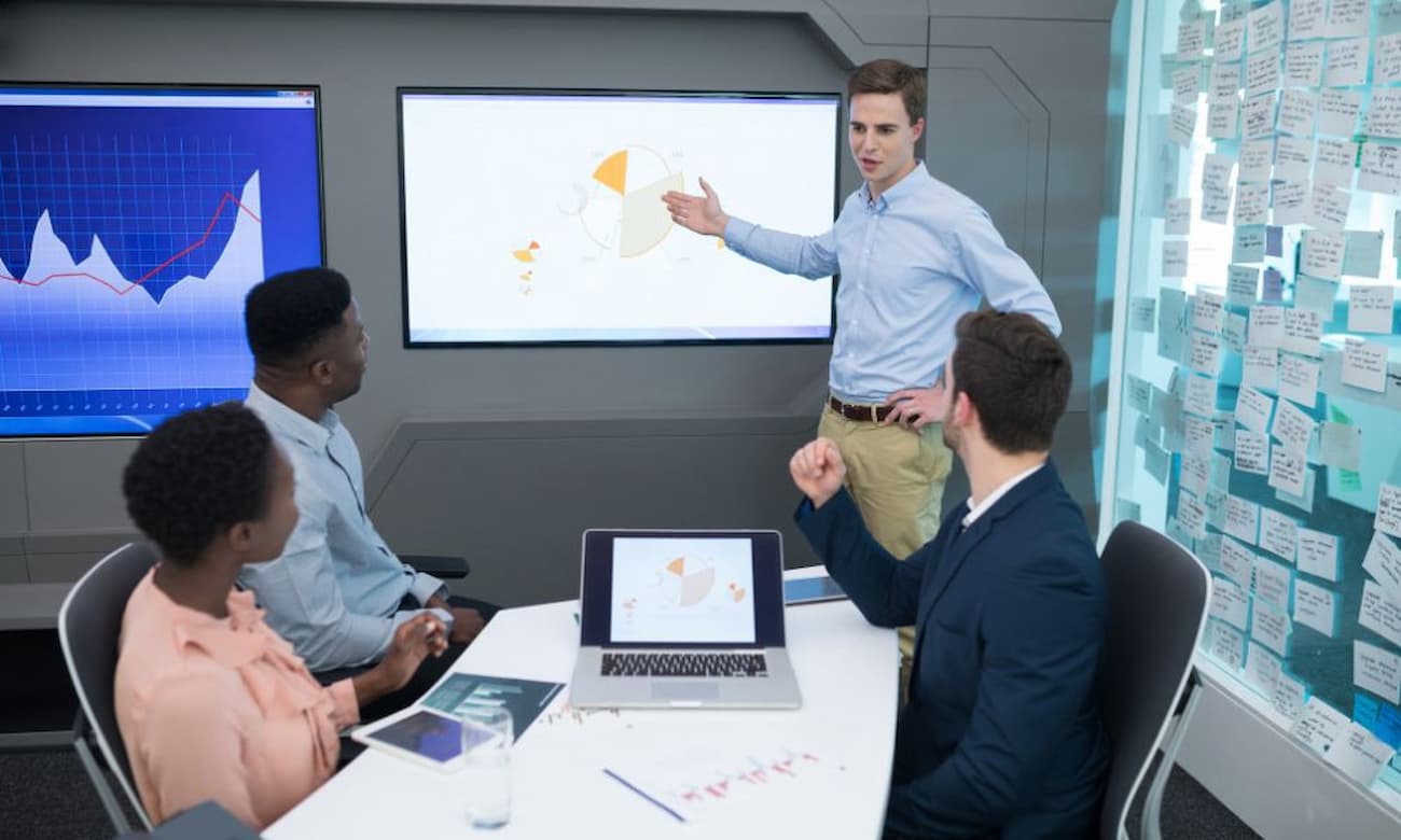 Data architect presenting data in a modern office