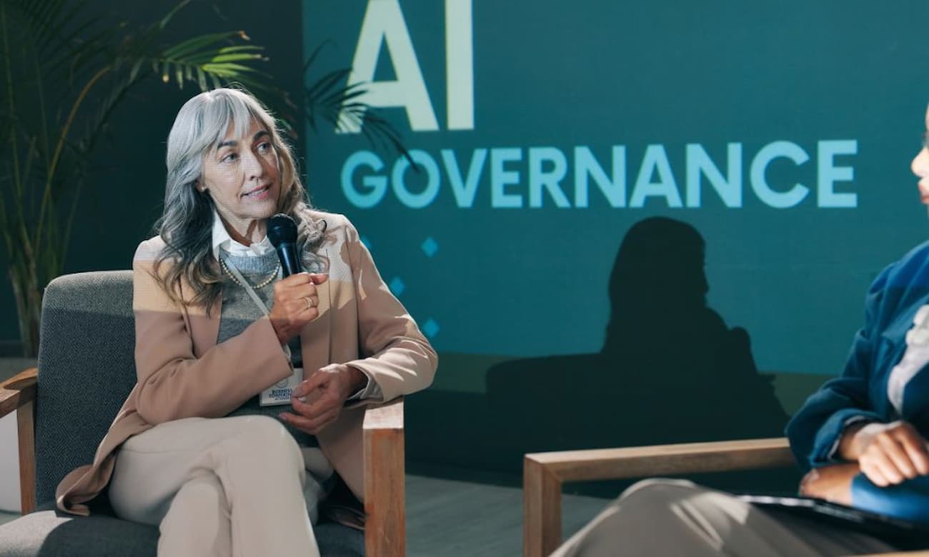 Business conference presentation with AI governance discussion