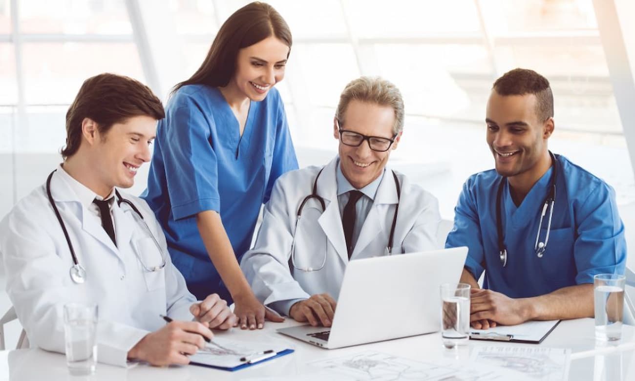 Smiling medical professionals working together